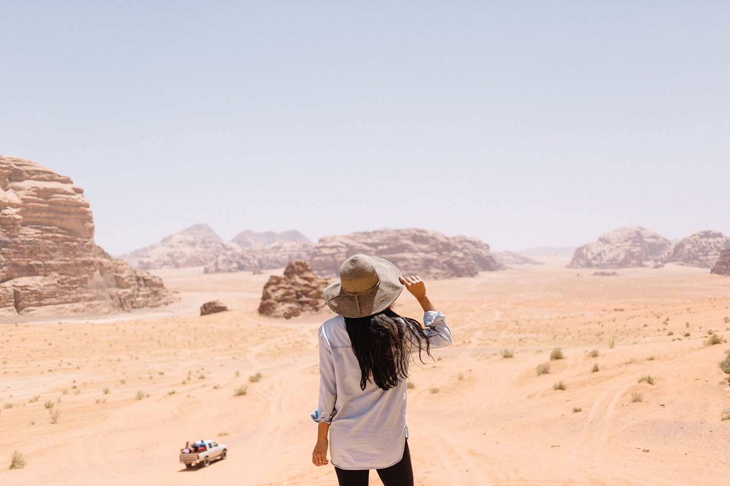 Rear View Of Woman Walking On Desert